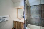 The upper level mater bathroom boasts a jetted tub, 2 vanities, a large walk-in shower and private toilet